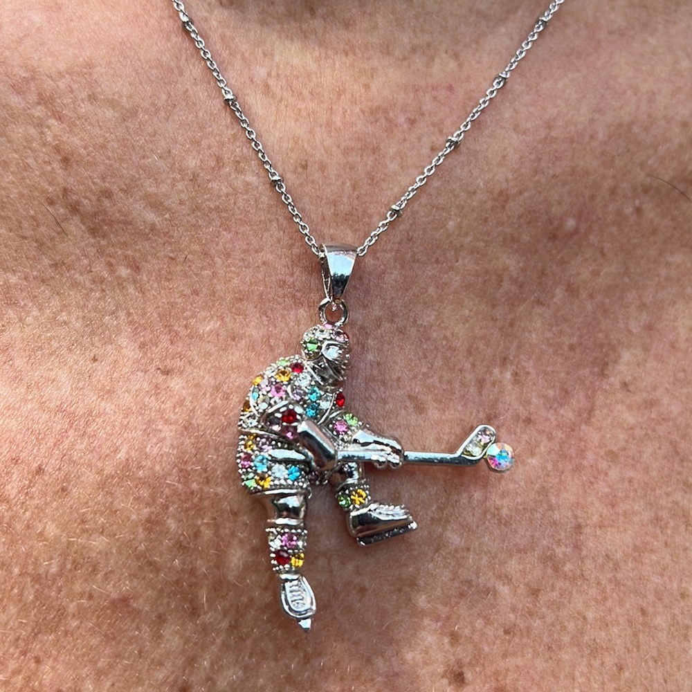 New multi colored crystal hockey player on 16” chain with 3” extender.